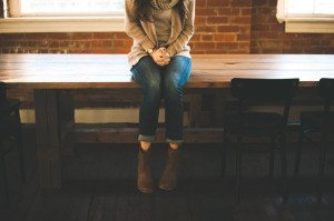 sitting on wooden table